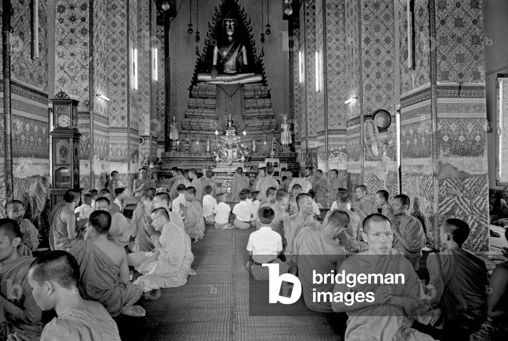 Buddhist monks praying at the temple, Bangkok, 1961 (b/w photo)