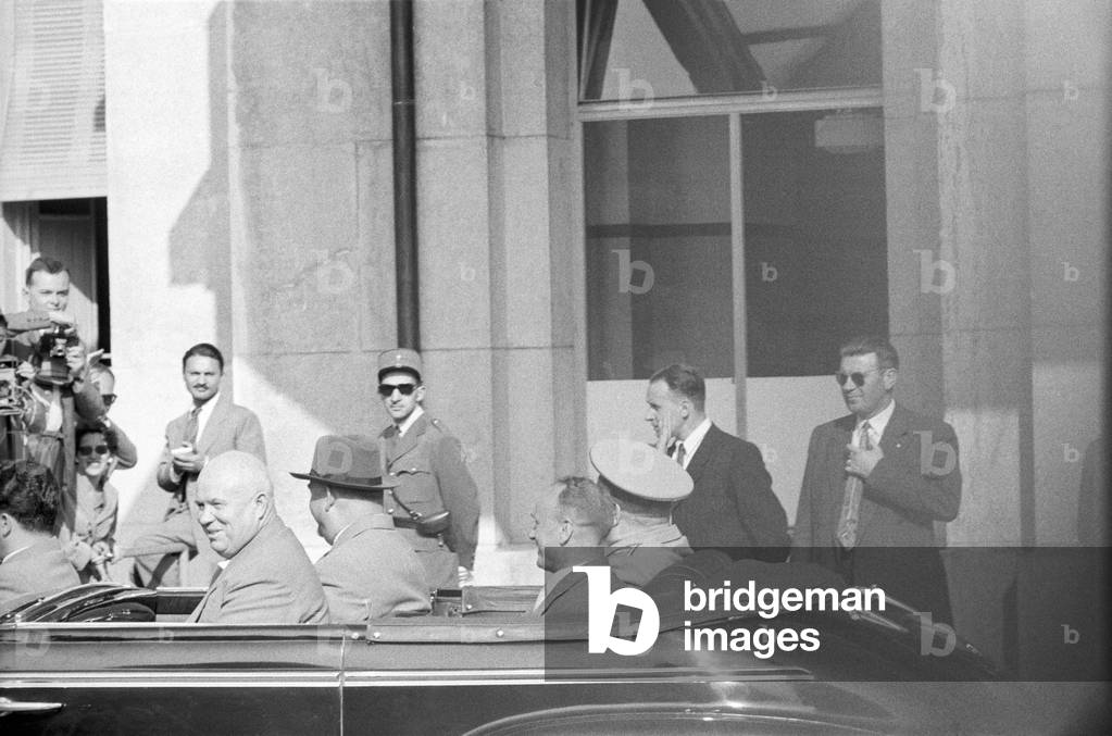 Nikita Khrushchev smiling on a car at the Geneva Summit, Geneva, Switzerland