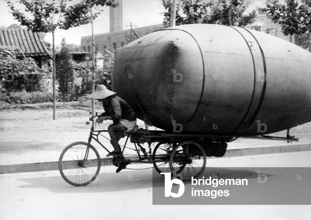 A man transporting methane on his bicycle