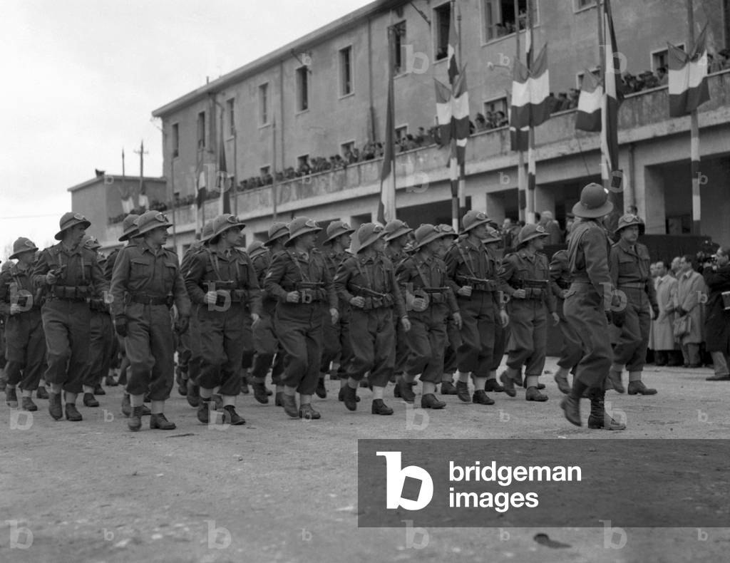 Italian soldiers marching along a street in Naples, Naples, Italy