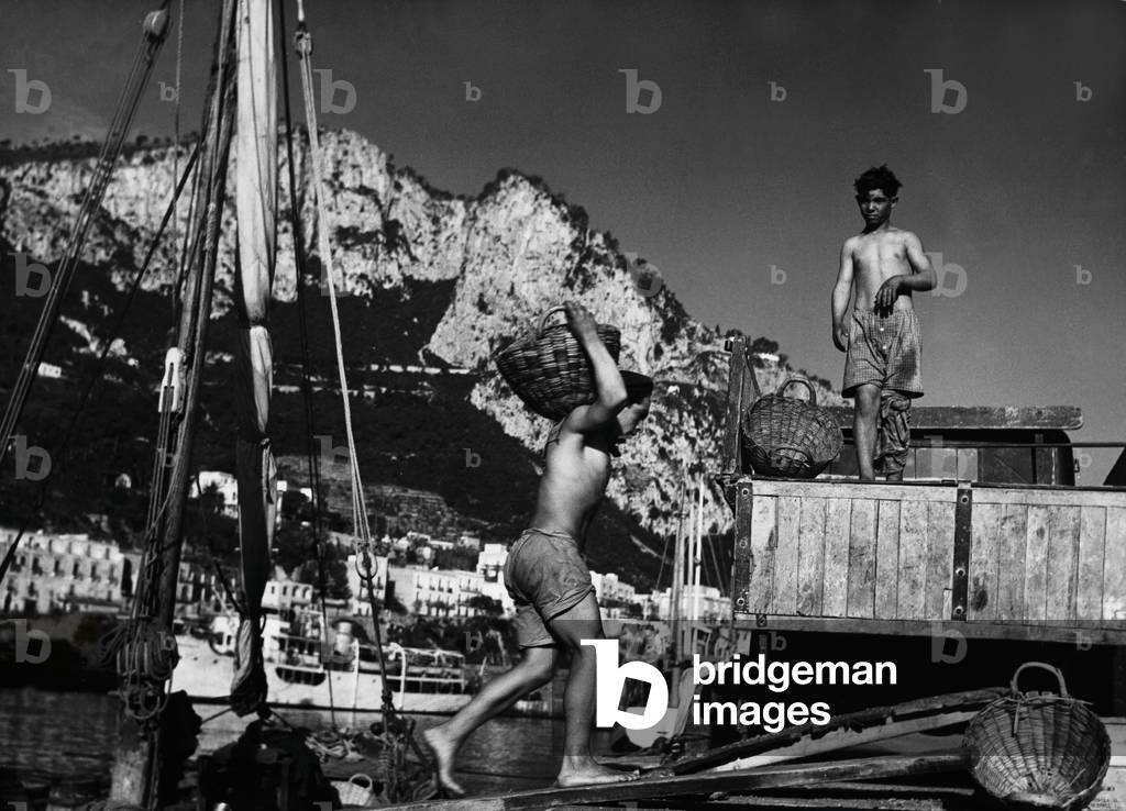 Two young men working, 1950 (b/w photo)