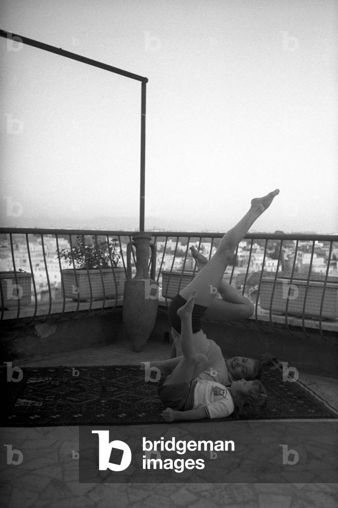 Esther Williams and her daughter doing exercises