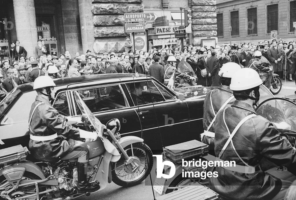 Richard Nixon's car escorted by Carabinieri riding moorbikes, Italy, 1969 (b/w photo)