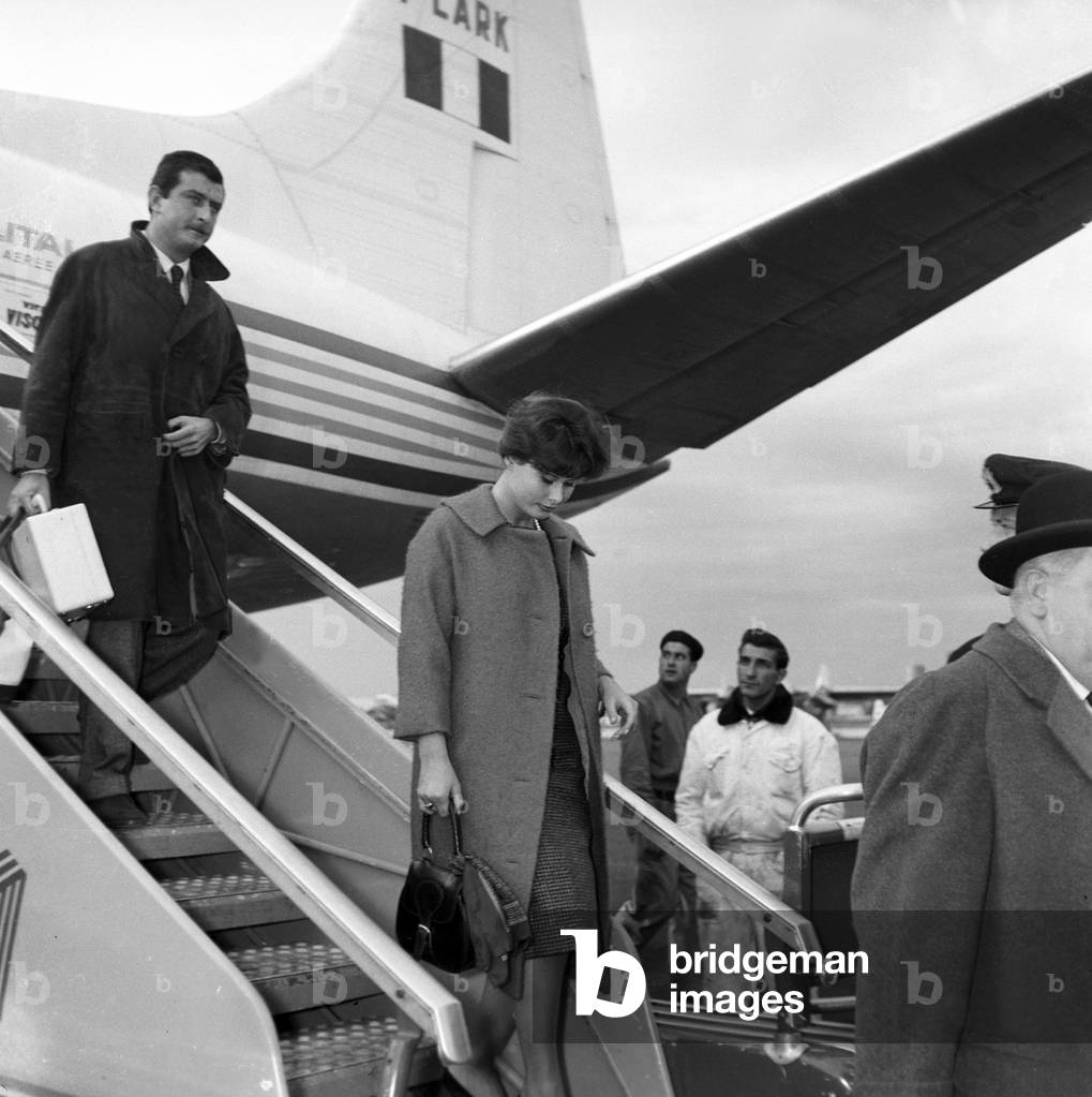 Marisa Allasio and Pier Francesco Calvi getting off the aircraft, Italy, 1958 (b/w photo)