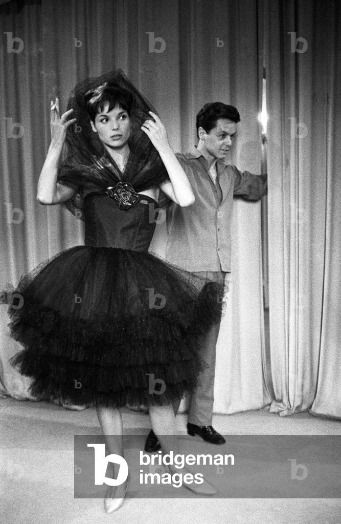 Roberto Capucci with a model wearing a tulle dress