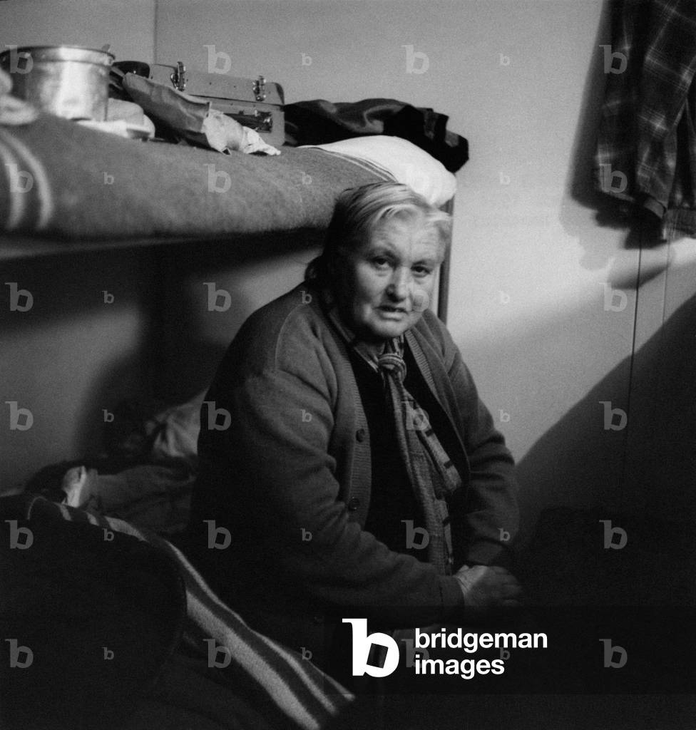 Refugee Istrian woman on a bunk bed, Trieste, Italy, 1956
