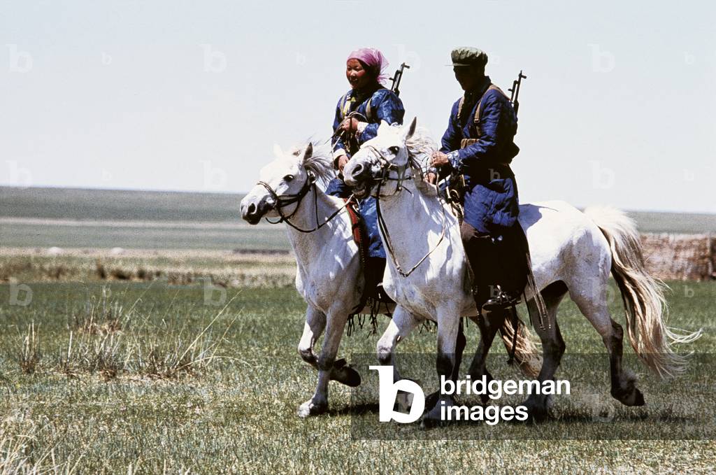 Two Mongolian armed guards on horseback, 1982 (photo)