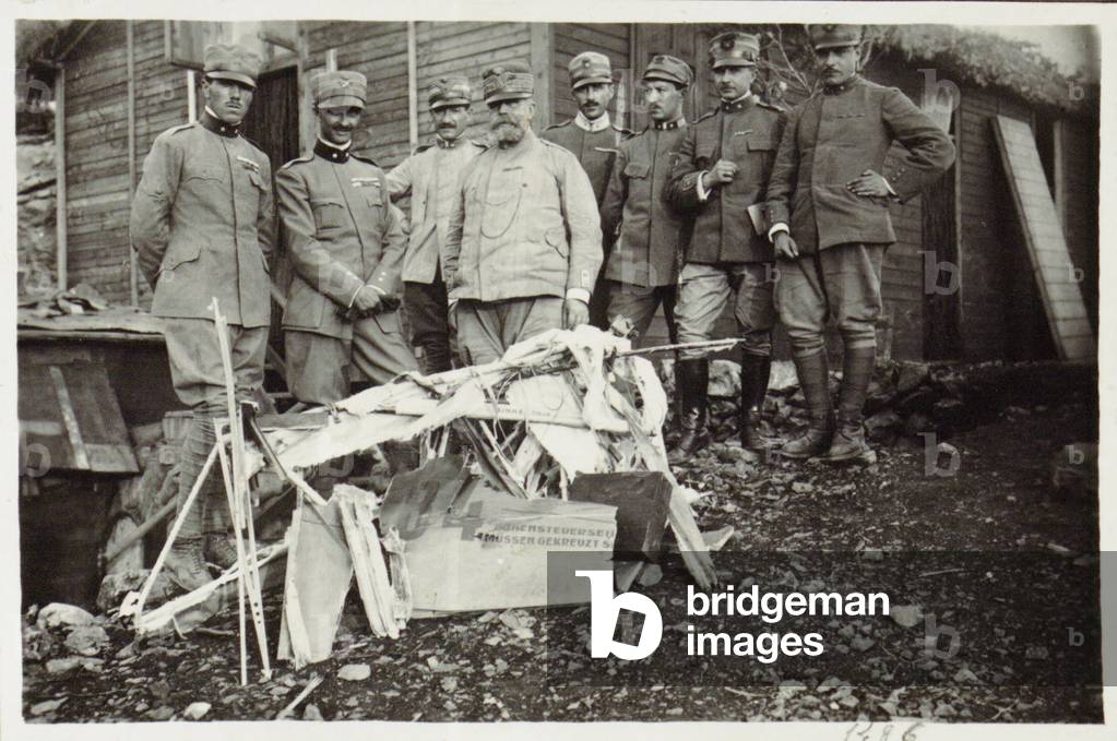 Francesco Baracca (the first one on the left) and other Italian officers pose in front of the ruins of an enemy aircraft, Italy