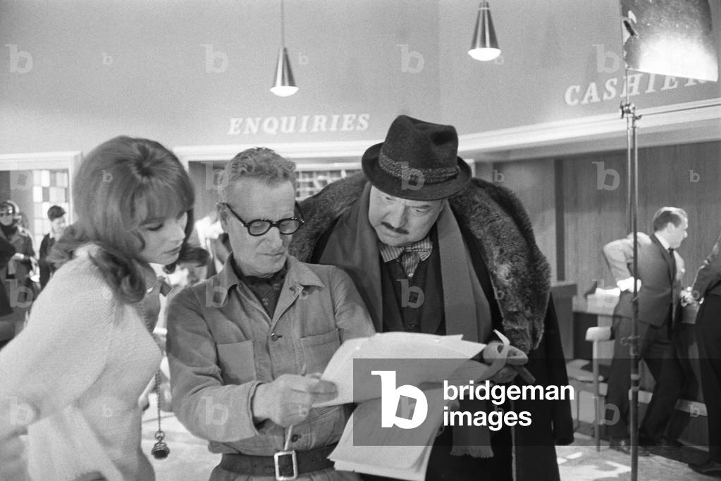 Elsa Martinelli, Anthony Asquith and Orson Welles in The Vip's, United Kingdom, London, 1963 (b/w photo)