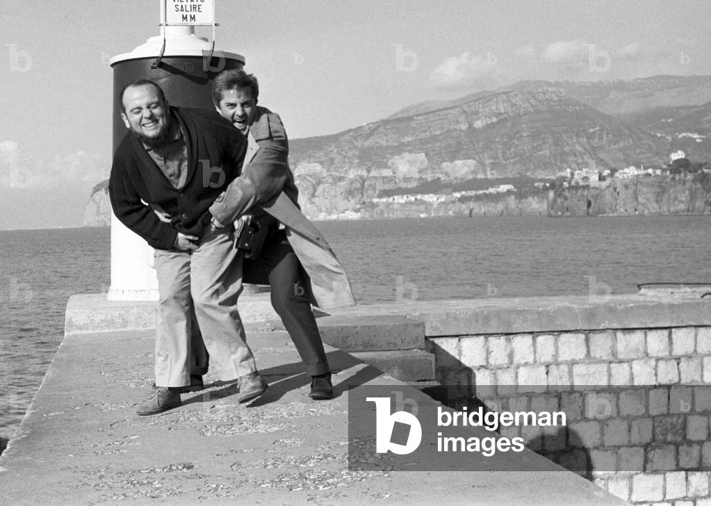 Federico Fellini and Marco Ferreri on a pier, Italy, 1955 (b/w photo)