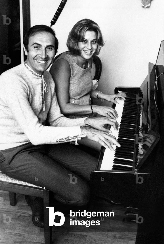 Pippo Baudo playing the piano with his wife Angela Lippi