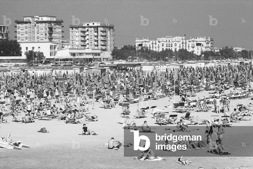 15th August 1969 - Crowds of bathers storming the beaches, Italy, 1969 (b/w photo)