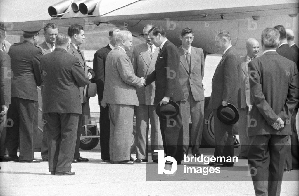Vyacheslav Molotov shaking the hand of a man at the Geneva Airport, Geneva, Switzerland