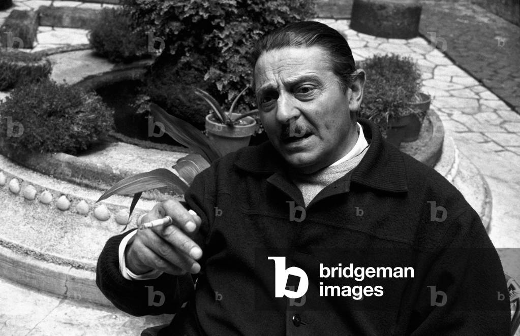 Alessandro Blasetti smoking on the set of Me, Me, Me... and the Others, Rome, Italy, 1965