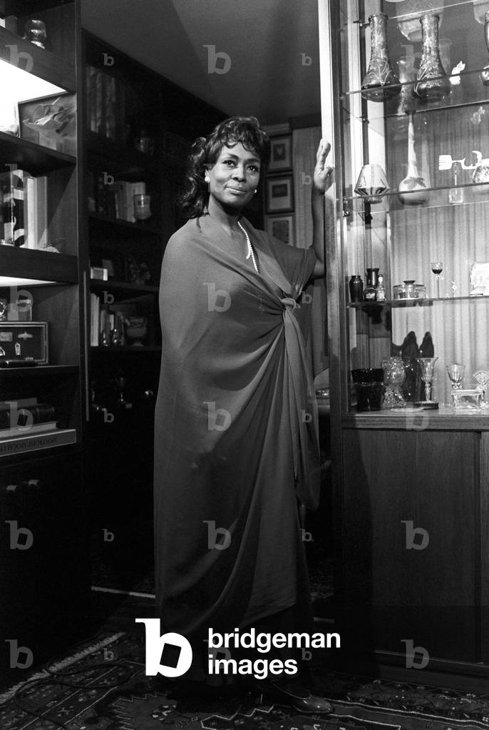 Shirley Verrett standing next to a display case