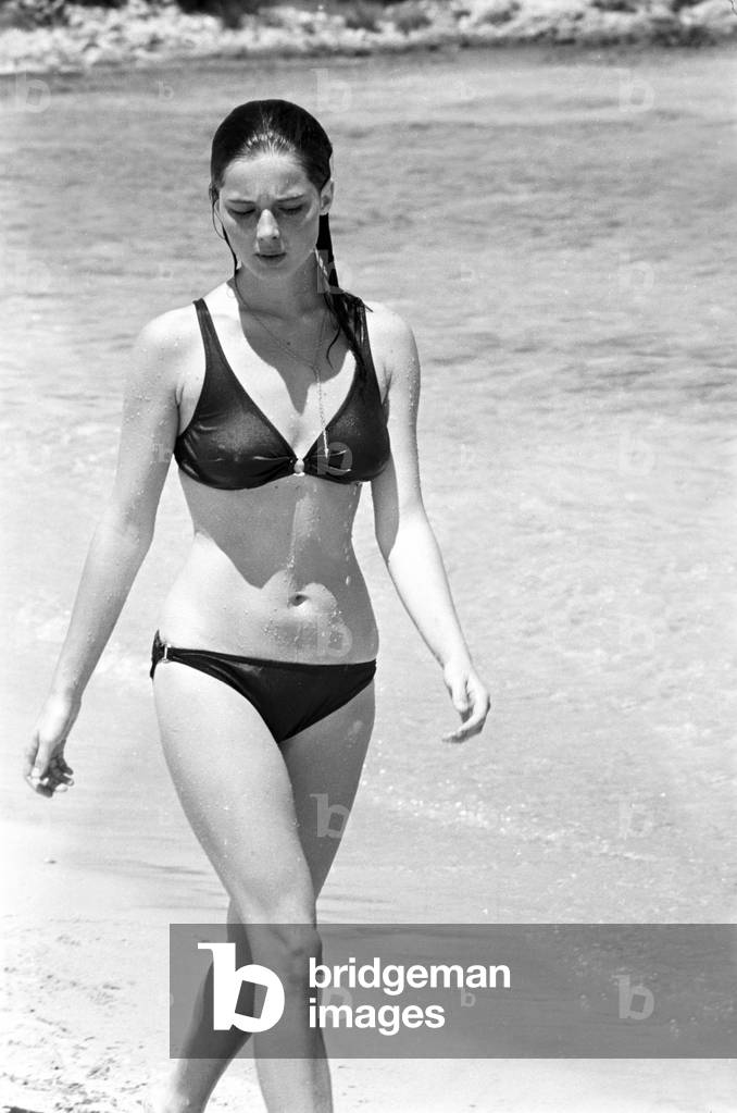Isabella Rossellini on the beach in Porto Rotondo, Italy, 1960 (b/w photo)