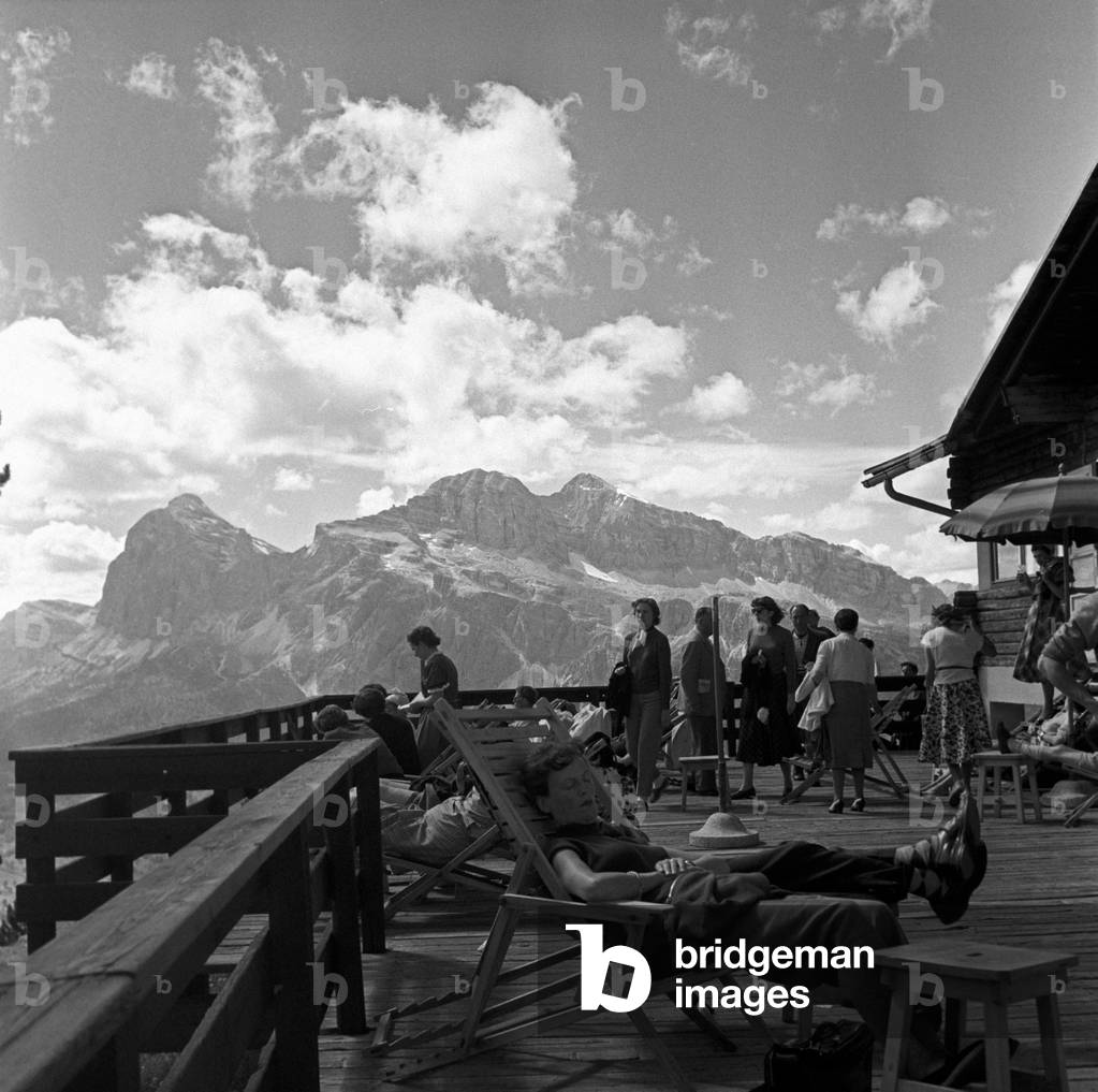 People on the terrace at the Faloria hut, Cortina d'Ampezzo, Italy