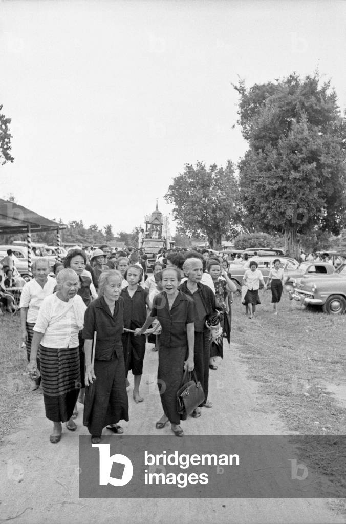 Thai women attending a religious celebration, Bangkok, 1961 (b/w photo)