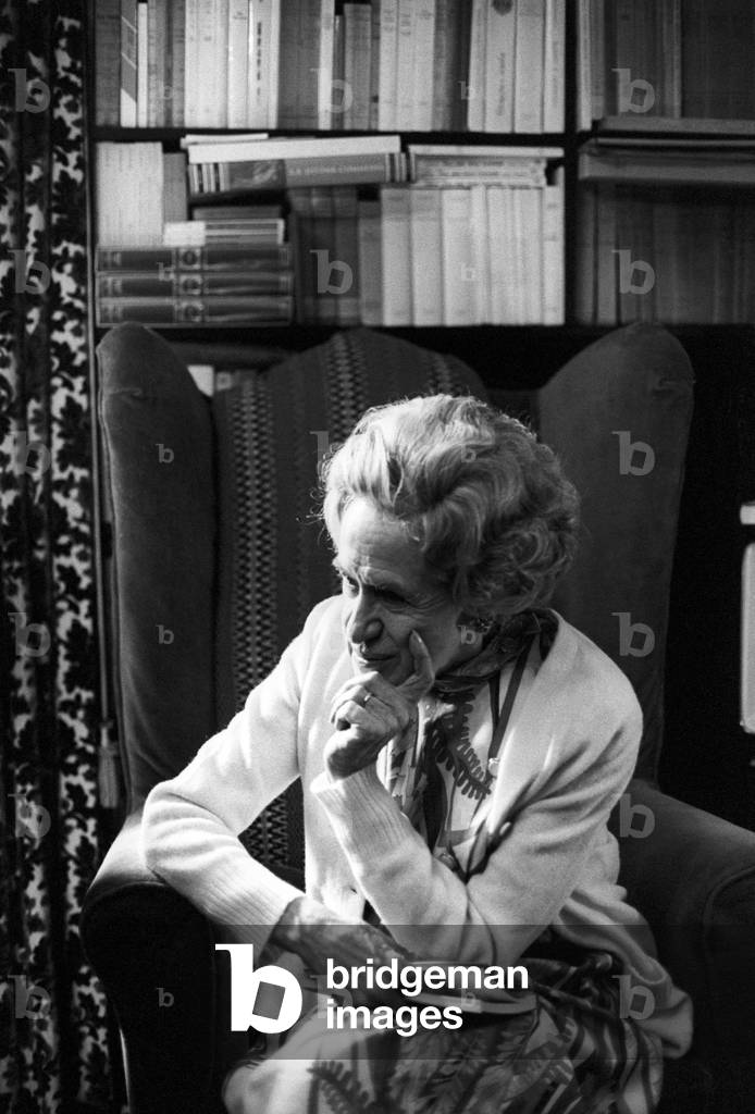 Gianna Manzini sitting in an armchair in a thoughtful pose