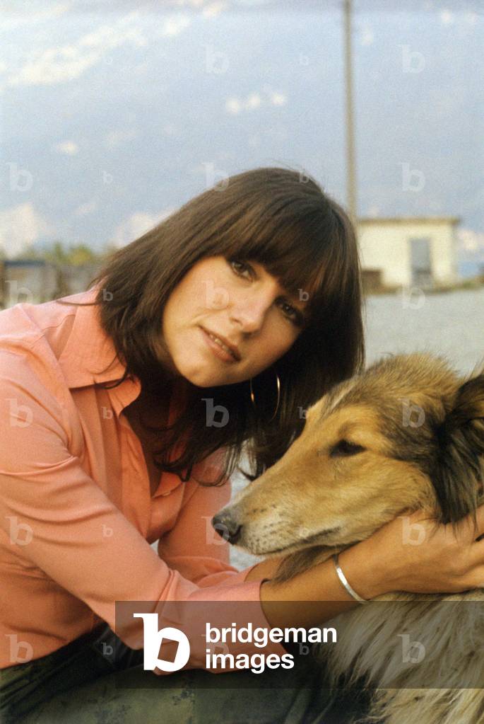 Stefania Sandrelli pets a collie dog