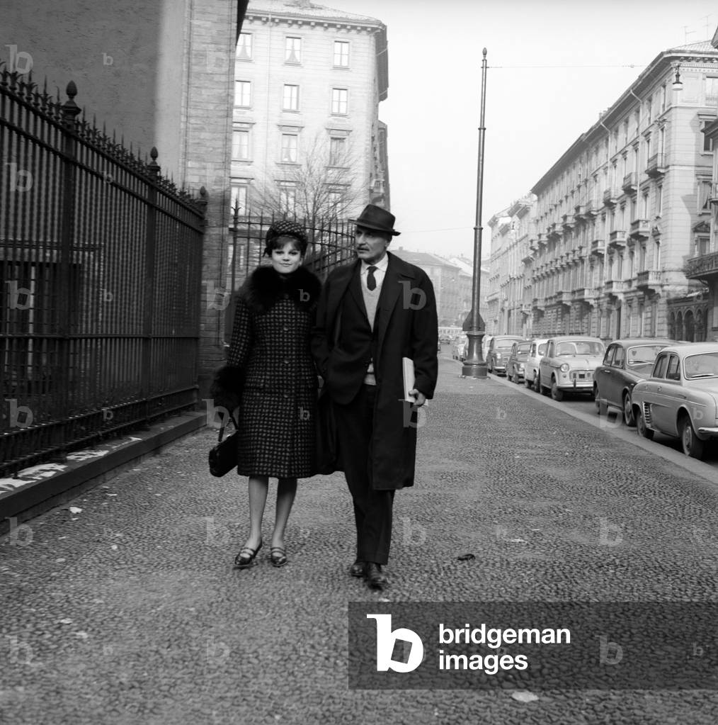 Singer Milva takes a stroll with her husband Maurizio Corgnati, 1963 (b/w photo)