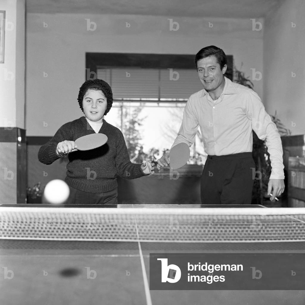 Marcello Mastroianni and his daughter Barbara playing table tennis, Italy, 1962 (b/w photo)