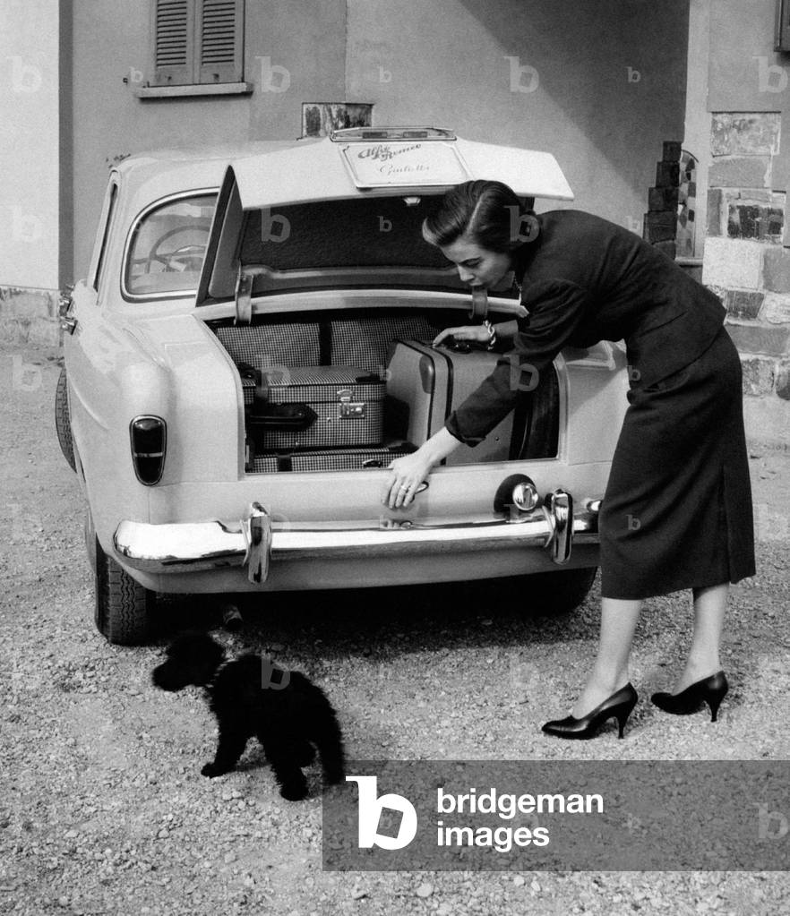 Anna Maria Ferrero beside an Alfa Romeo Giulietta,  Milan, Italy