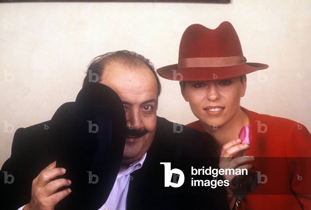 Maurizio Costanzo and Maria De Filippi wearing hats