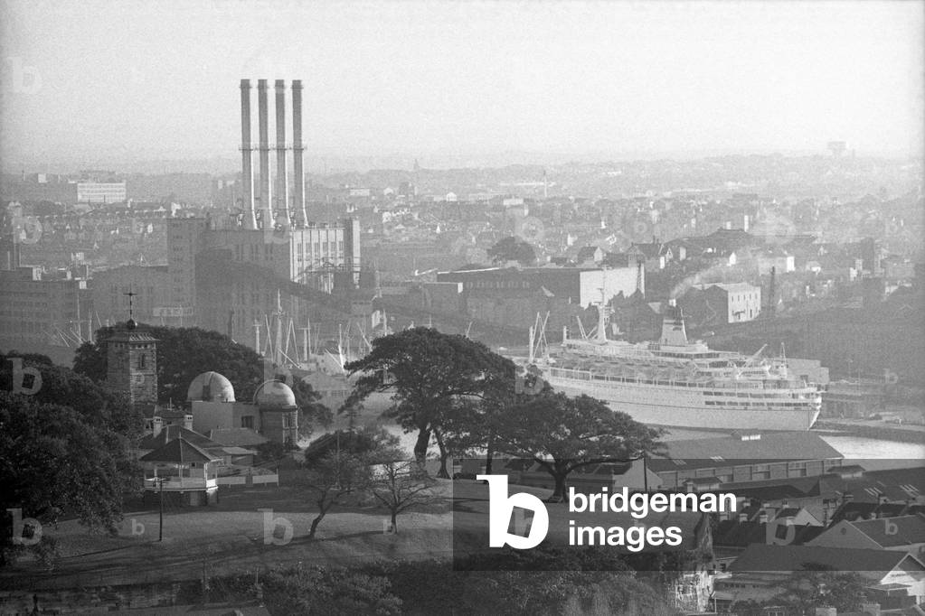 View of the city with the observatory and a factory in the distance, Sydney, Australia, 1967 (b/w photo)