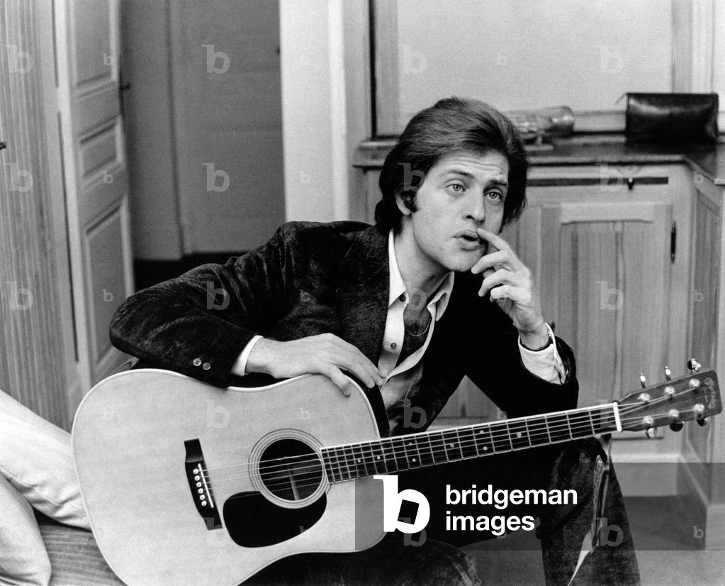 Portrait of Joe Dassin with a guitar, Paris, France