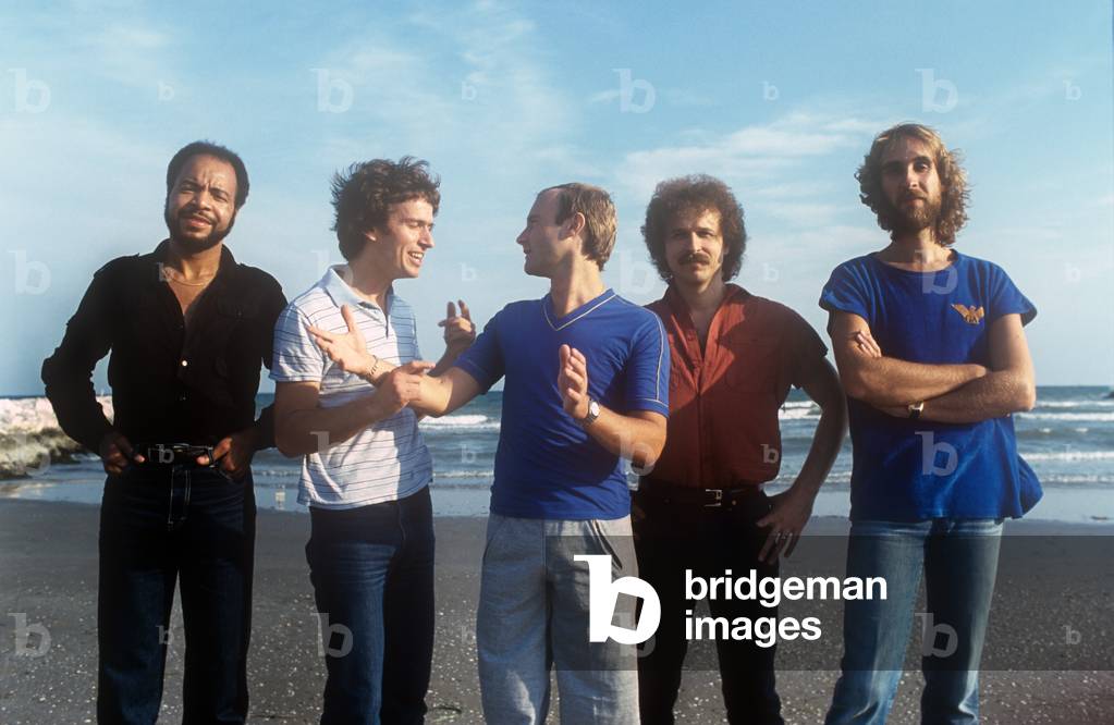 Portrait of Chester Thompson, Tony Banks, Phil Collins, Daryl Stuermer and Mike Rutherford on a beach