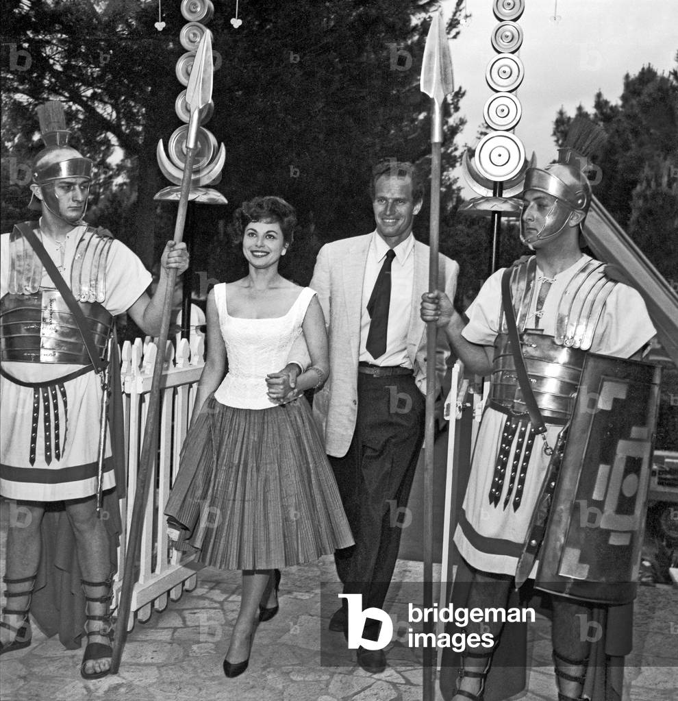 Charlton Heston and Haya Harareet  at the cocktail in Cinecittà, Rome, Italy, 1958 (b/w photo)