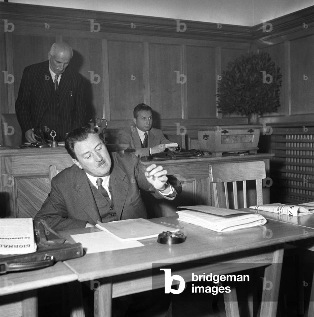 Citizens of Trento and South Tyrol attending a meeting at a polling station during the regional election in Trentino-Alto Adige/Sudtirol, Italy, November 1952 (b/w photo)