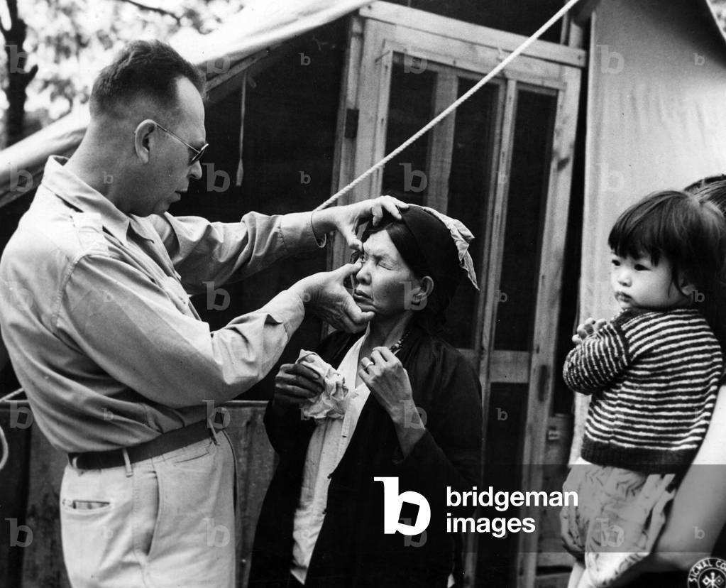 Nonie Worth Gabel examining an Asian woman