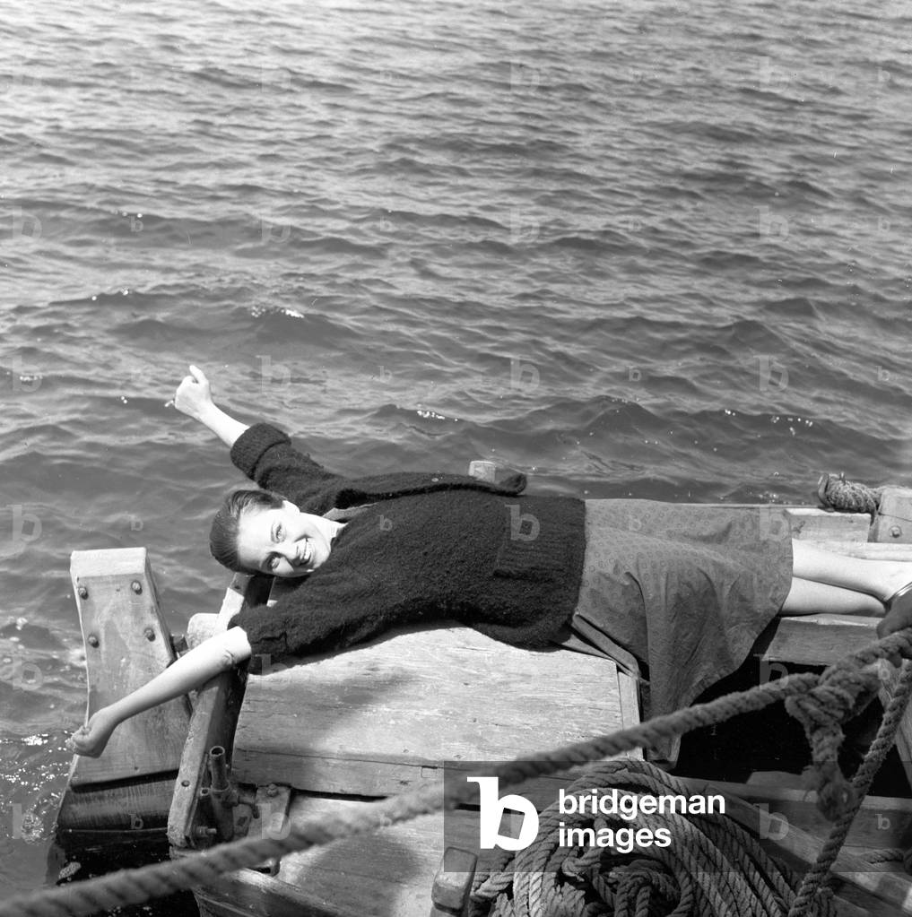 Alida Valli on the set of 'The Wide Blue Road', Italy, 1957 (b/w photo)
