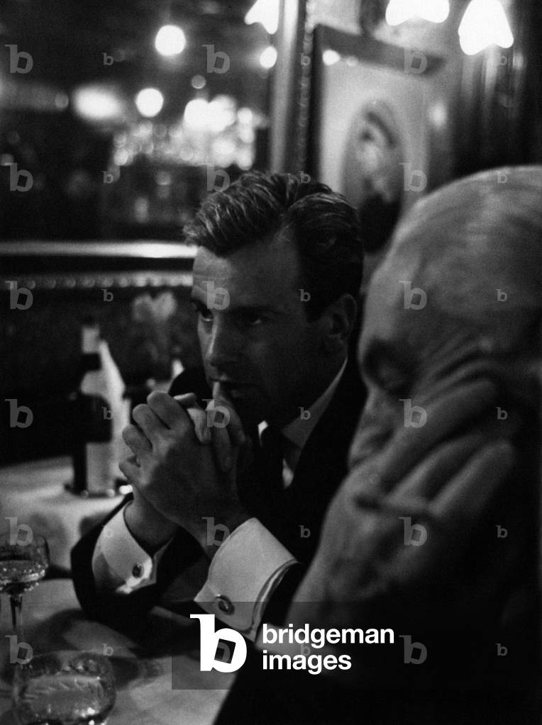 Maximilian Schell having dinner with Carlo Ponti, 1962 (b/w photo)