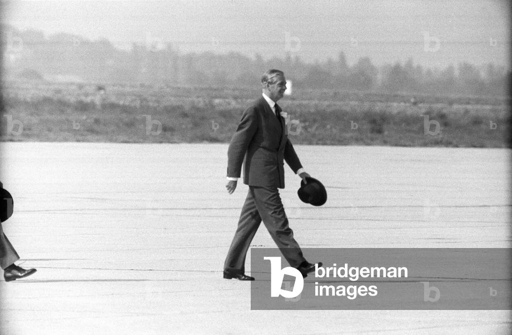 Anthony Eden walking on the landing field of the Geneva Airport, Geneva, Switzerland