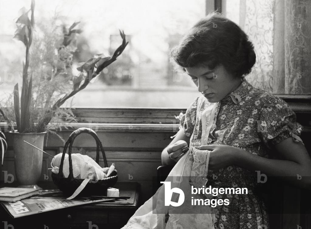 A girl doing crochet, 1960 (b/w photo)