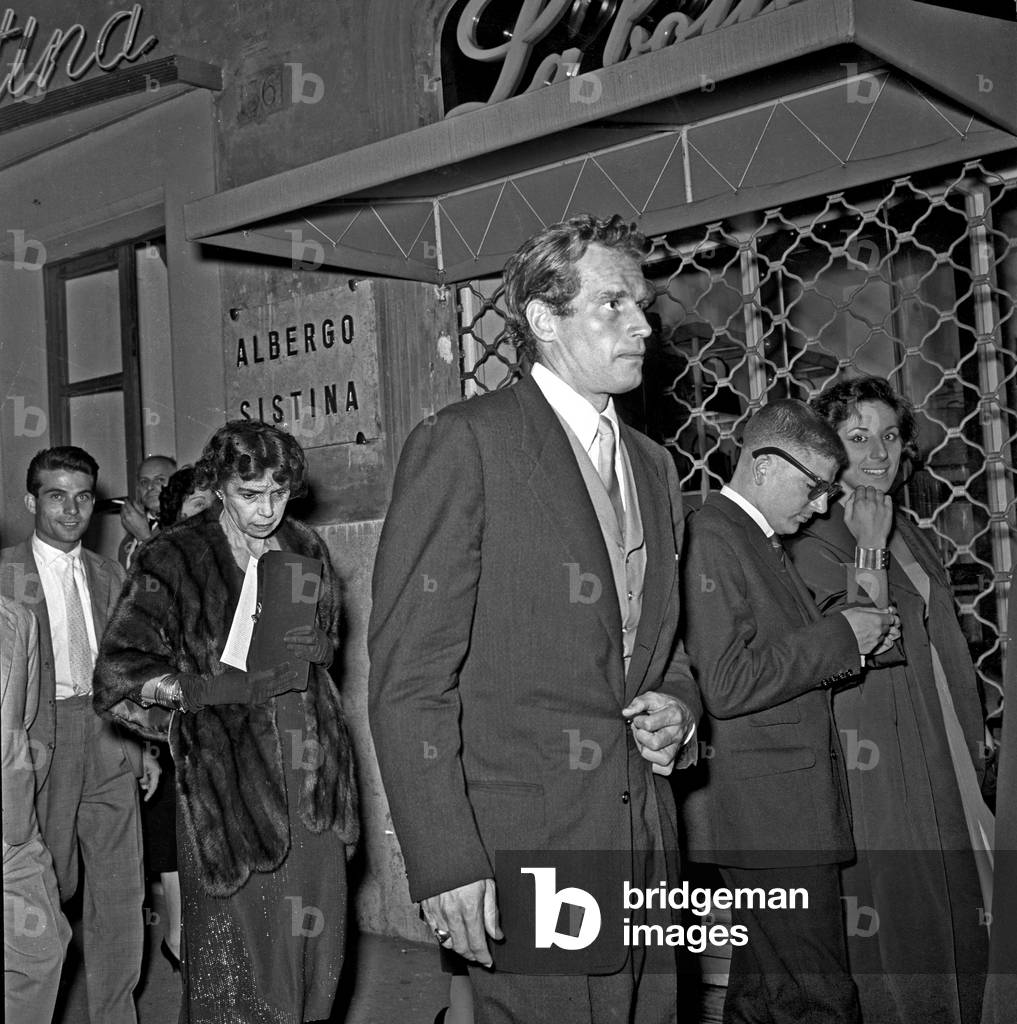 Charlton Heston and his mother Lila Charlton leaving teatro Sistina, Rome, Italy, 1958 (b/w photo)