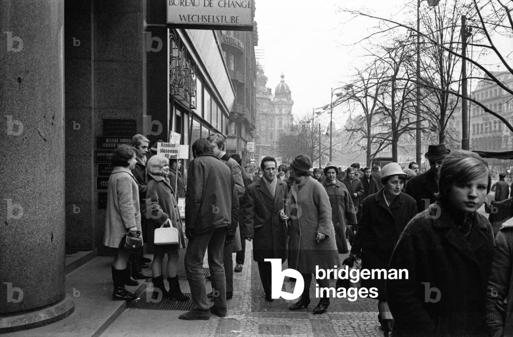 People crowding the streets on Christmas' Eve, Prague, Czech Republic, December 1968 (b/w photo)