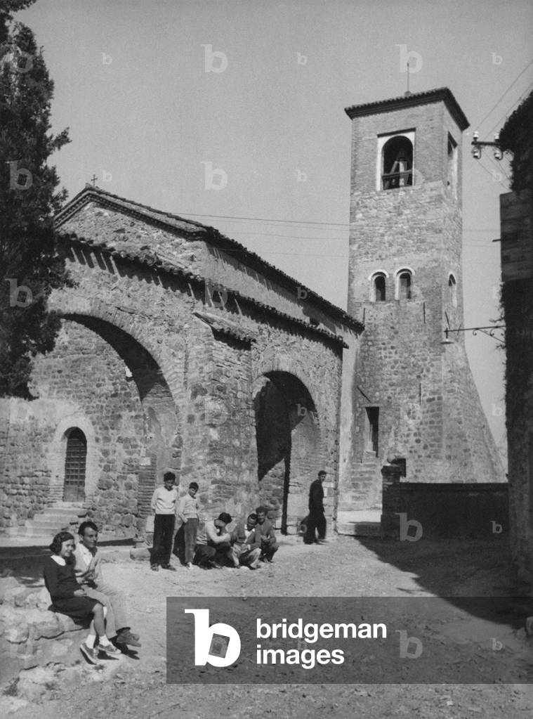 People sitting by the Oratorio della Santissima Trinità in Arquà Petrarca, Arquà Petrarca, Italy