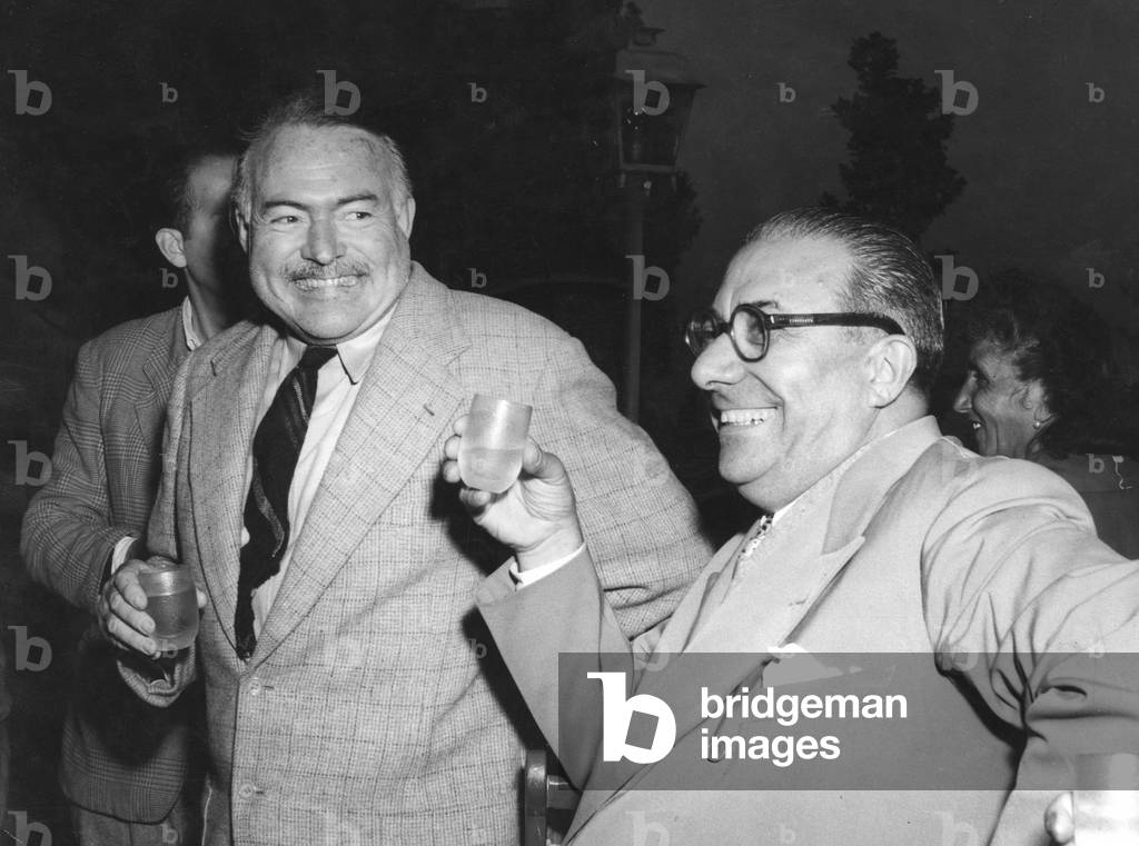 Ernest Hemingway smiling with Arnoldo Mondadori
