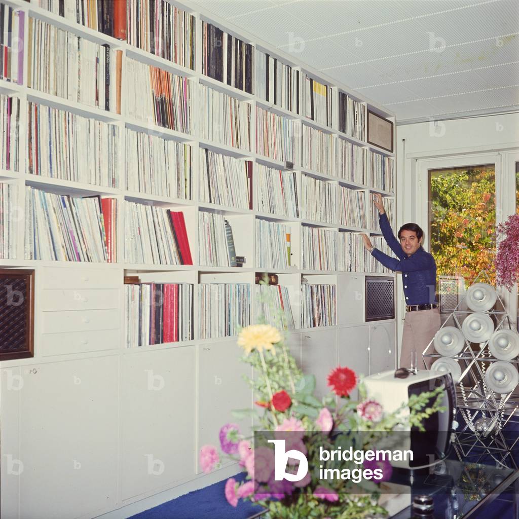 Gianni Boncompagni near a bookcase, Italy