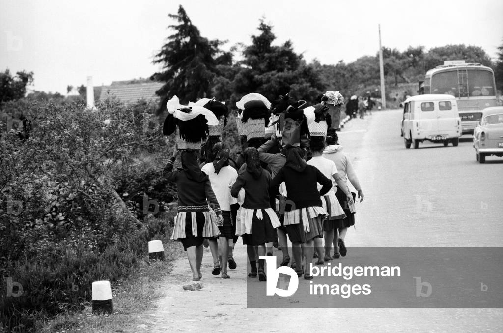 Portuguese pilgrims heading to Fatima, Portugal, 1967 (b/w photo)
