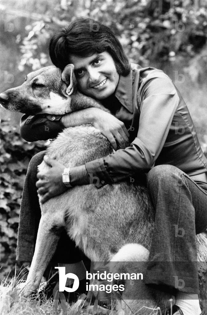 Patrick Samson hugging a dog
