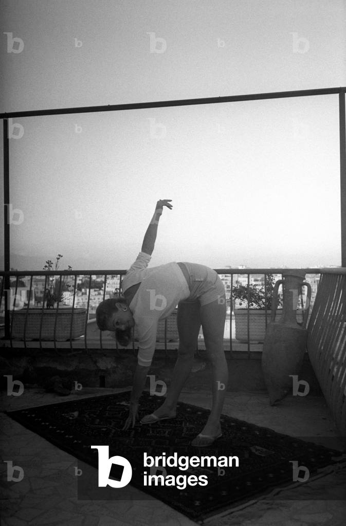 Esther Williams doing exercises on the terrace