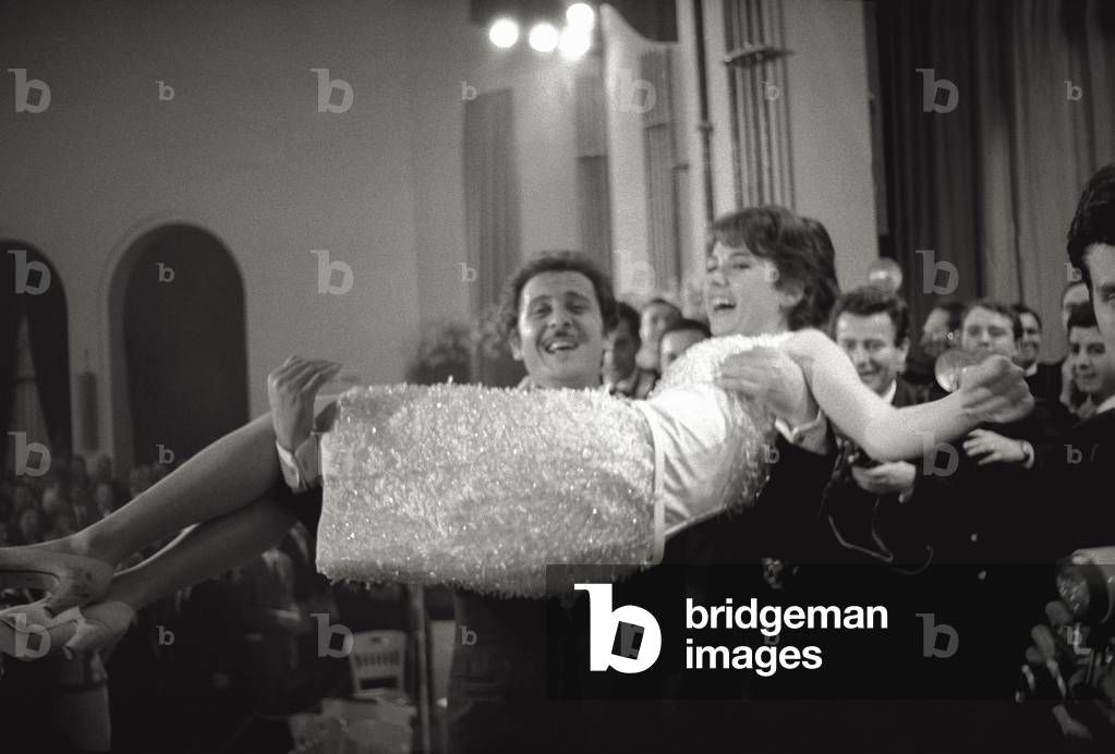 Domenico Modugno is picking up Gigliola Cinquetti, 1966 (b/w photo)
