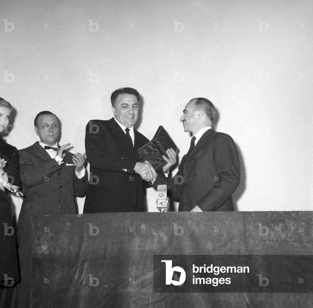 Federico Fellini and Alberto Lattuada at a prize ceremony, Italy, 1957 (b/w photo)