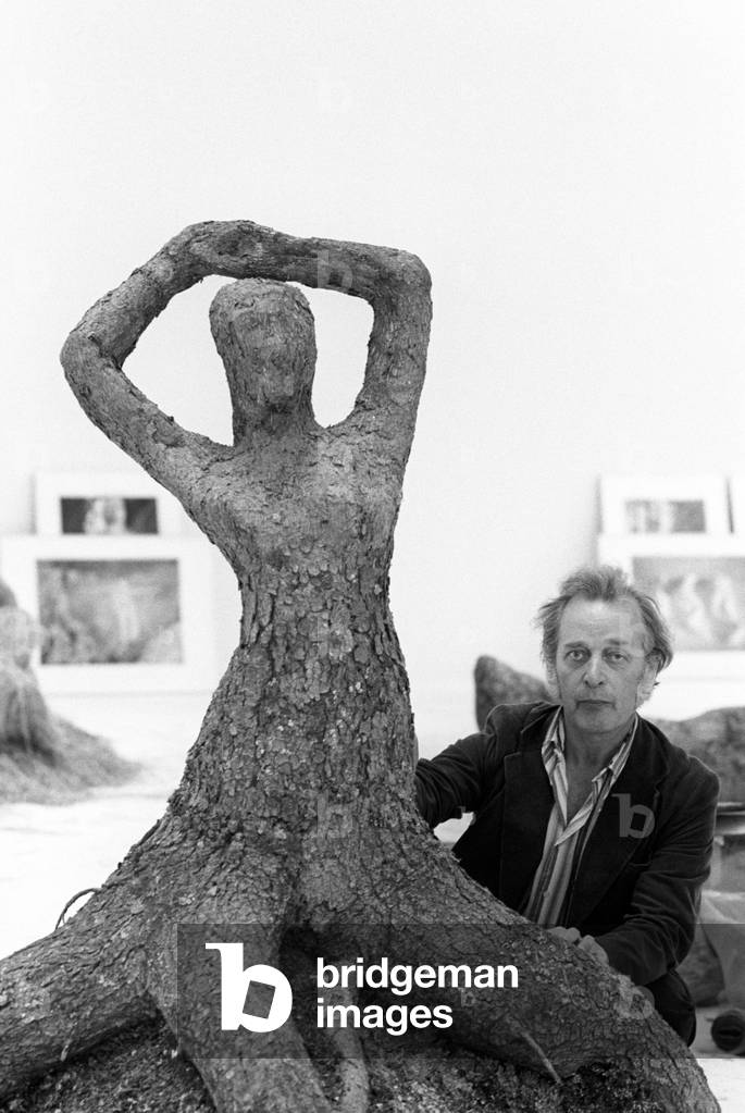 Olavi Lanu with one of his vegetal sculpture
