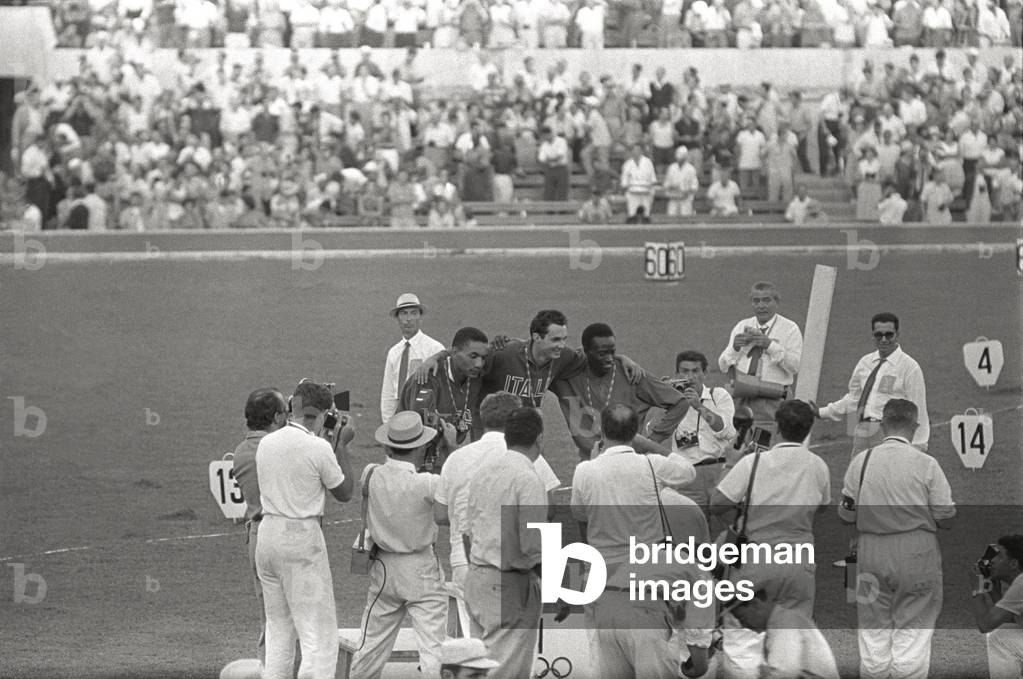 Livio Berruti, Lester Carney and Abdoulaye Seye being awarded